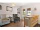 Cozy seating area with two chairs, a table, butcher block island, and French doors leading to the outdoors at 20155 E Davies Ave, Centennial, CO 80016