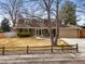 Charming two-story home with a manicured lawn and fenced yard, set in a residential neighborhood at 7197 S Newland St, Littleton, CO 80128