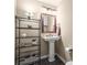 Cozy half-bathroom with a pedestal sink and elegant decor at 7197 S Newland St, Littleton, CO 80128