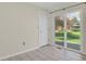 Bright living area with sliding glass doors leading to a well maintained outdoor green space at 8001 S Estes St, Littleton, CO 80128
