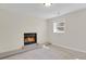 Inviting living room with a brick fireplace, large window, and neutral-toned walls at 8001 S Estes St, Littleton, CO 80128