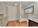 Bathroom featuring an open closet space, a walk-in shower, and a vanity with a granite countertop at 2015 Elmira St, Aurora, CO 80010