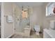 Modern bathroom featuring a glass shower, tiled walls, and sleek fixtures at 2015 Elmira St, Aurora, CO 80010