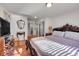 Bedroom with wood floors, large closet, and natural light from the window at 2015 Elmira St, Aurora, CO 80010