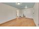 Bright bedroom with hardwood floors, a blue ceiling, and ample natural light from multiple windows at 2015 Elmira St, Aurora, CO 80010