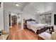 Bedroom with wood floors, large closet, and natural light from the window at 2015 Elmira St, Aurora, CO 80010