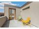 Balcony with chairs and a peek-a-boo view of the city at 1012 Bannock St, Denver, CO 80204