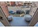 Cozy outdoor balcony with textured outdoor pavers, city views, and urban charm at 1012 Bannock St, Denver, CO 80204