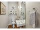 Stylish half bathroom featuring modern fixtures, floating sink, pendant lighting, and decorative accents at 1012 Bannock St, Denver, CO 80204