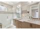 Serene bathroom featuring a glass enclosed shower, double sink vanity, and modern fixtures at 1012 Bannock St, Denver, CO 80204