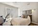 Bright bedroom showcasing a ceiling fan, plush bed, and access to a private balcony at 1012 Bannock St, Denver, CO 80204