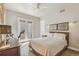 Comfortable bedroom featuring a ceiling fan, balcony access, and modern furnishings at 1012 Bannock St, Denver, CO 80204