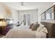 Comfortable bedroom with a ceiling fan, warm color palette, and patio access, filled with natural light at 1012 Bannock St, Denver, CO 80204