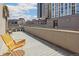 Relaxing rooftop deck features ample space and seating with views of the Denver skyline at 1012 Bannock St, Denver, CO 80204