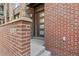 Brick entrance of the building with number display, clean lines, and modern door design at 1012 Bannock St, Denver, CO 80204