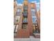 Modern brick condo with metal accents on a sunny day at 1012 Bannock St, Denver, CO 80204