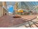 Expansive exterior view of the convention center, with glass panels, sculpture, and brick walkway at 1012 Bannock St, Denver, CO 80204