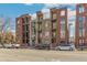 Stylish brick building with modern balconies, showcasing a sleek and attractive design at 1012 Bannock St, Denver, CO 80204