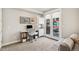 Cozy office space with a desk, cabinets, and a large window that lets in natural light at 1012 Bannock St, Denver, CO 80204