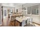 Modern eat-in kitchen with stainless appliances and counter seating at 1012 Bannock St, Denver, CO 80204
