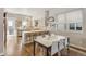 Modern kitchen and dining area with hardwood floors and bar seating at 1012 Bannock St, Denver, CO 80204