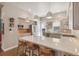 Modern kitchen featuring an island with bar stools and pendant lighting at 1012 Bannock St, Denver, CO 80204