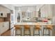 Modern kitchen featuring a breakfast bar with seating and sleek appliances at 1012 Bannock St, Denver, CO 80204