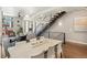 Open living room featuring a dining area and modern staircase design at 1012 Bannock St, Denver, CO 80204