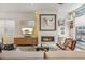 Bright living room with modern decor, a fireplace, and a work area at 1012 Bannock St, Denver, CO 80204
