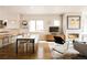 Open-concept living and dining area with hardwood floors and modern fireplace, perfect for entertaining and Gathering gatherings at 1012 Bannock St, Denver, CO 80204