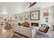 Open-concept living space with hardwood floors and a modern fireplace at 1012 Bannock St, Denver, CO 80204