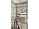 Staircase featuring a large multi-pane window, modern architectural lighting fixture and urban views at 1012 Bannock St, Denver, CO 80204