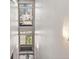 Staircase featuring a large multi-pane window, and modern architectural lighting fixture at 1012 Bannock St, Denver, CO 80204