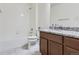 Bathroom featuring tile flooring, a tiled shower-tub, granite countertop and modern fixtures at 15195 E 16 Th Pl # 104, Aurora, CO 80011