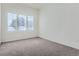 Bedroom with carpet, natural light streaming through the window and neutral walls at 15195 E 16 Th Pl # 104, Aurora, CO 80011