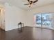 Hardwood floors complement the light and bright living room with sliding door at 15195 E 16 Th Pl # 104, Aurora, CO 80011