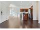 Bright living space featuring hardwood floors, open concept, and modern appliances at 15195 E 16 Th Pl # 104, Aurora, CO 80011