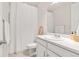Bathroom features a single vanity, toilet, and shower with a white shower curtain at 5900 Haywagon Ln, Castle Rock, CO 80108