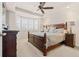 Primary bedroom with tray ceilings, bay window, and ample natural light at 5900 Haywagon Ln, Castle Rock, CO 80108