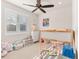 Cozy bedroom featuring carpet, bunk beds, and a window with blinds at 5900 Haywagon Ln, Castle Rock, CO 80108