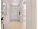 Bright entryway with tile flooring and stylish mirror, leading into the home at 5900 Haywagon Ln, Castle Rock, CO 80108