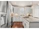 Modern kitchen featuring stainless steel appliances, granite countertops, and hardwood floors at 5900 Haywagon Ln, Castle Rock, CO 80108