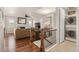 Cozy living room with a fireplace, hardwood floors, and a stacked washer/dryer set at 5900 Haywagon Ln, Castle Rock, CO 80108