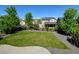 Well-maintained backyard with green grass, gravel and a fence at 7081 S Oak Hill Cir, Aurora, CO 80016