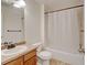 Cozy bathroom with a shower and tub combo and a vanity with a mirror at 7081 S Oak Hill Cir, Aurora, CO 80016