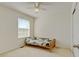 Comfortable carpeted bedroom with natural light and space for rest and study at 7081 S Oak Hill Cir, Aurora, CO 80016