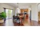 Eat-in kitchen with modern appliances, an island, and a sliding door to the backyard at 7081 S Oak Hill Cir, Aurora, CO 80016