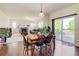 Spacious living room with hardwood floors, stone fireplace, and sliding glass doors to outdoor deck at 7081 S Oak Hill Cir, Aurora, CO 80016