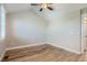 Bright bedroom featuring hardwood floors, neutral walls and white trim, creating a serene living space at 3411 N Xenia St, Denver, CO 80238