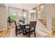 Bright dining area with modern chandelier lighting, creating an ideal space for gatherings at 3411 N Xenia St, Denver, CO 80238